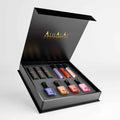 Ensemble de vernis à ongles luxueux d’Alhalal Cosmetics avec quatre couleurs différentes de vernis à ongles dans un élégant emballage noir